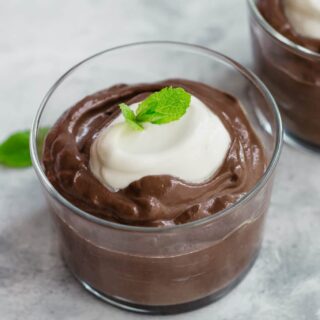 Keto chocolate avocado mousse with cream cheese frosting