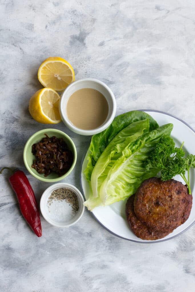 Ingredients for turkey burgers with lettuce and caramelised onions
