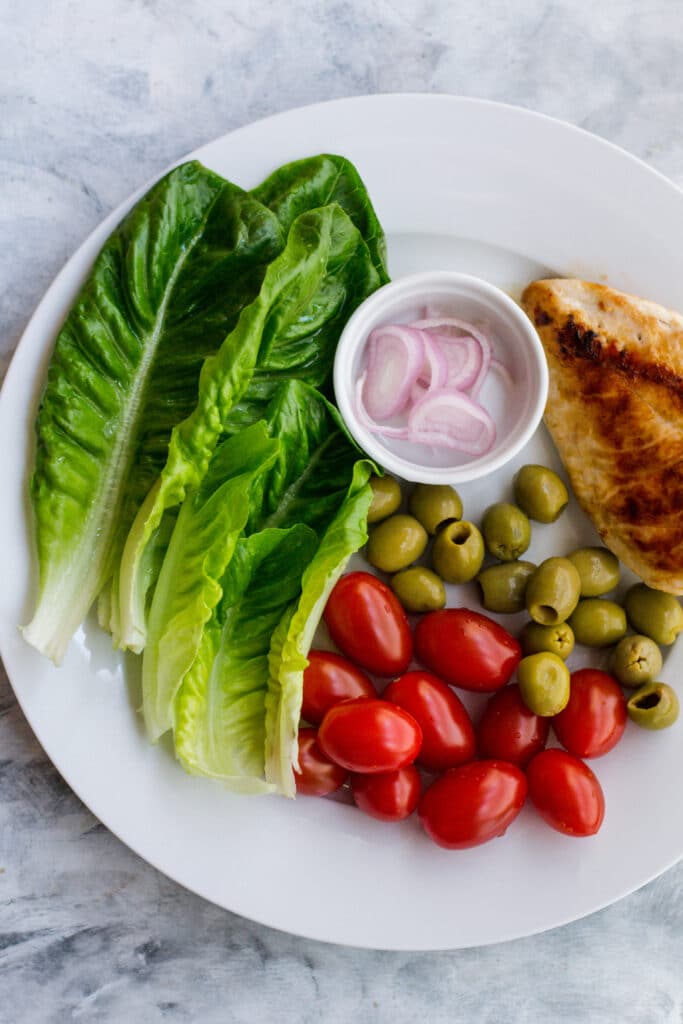 Ingredients for keto grilled chicken salad on a plate