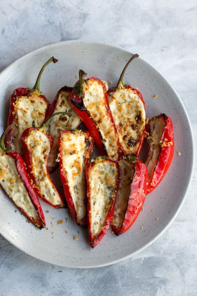Cream cheese stuffed mini peppers on a plate