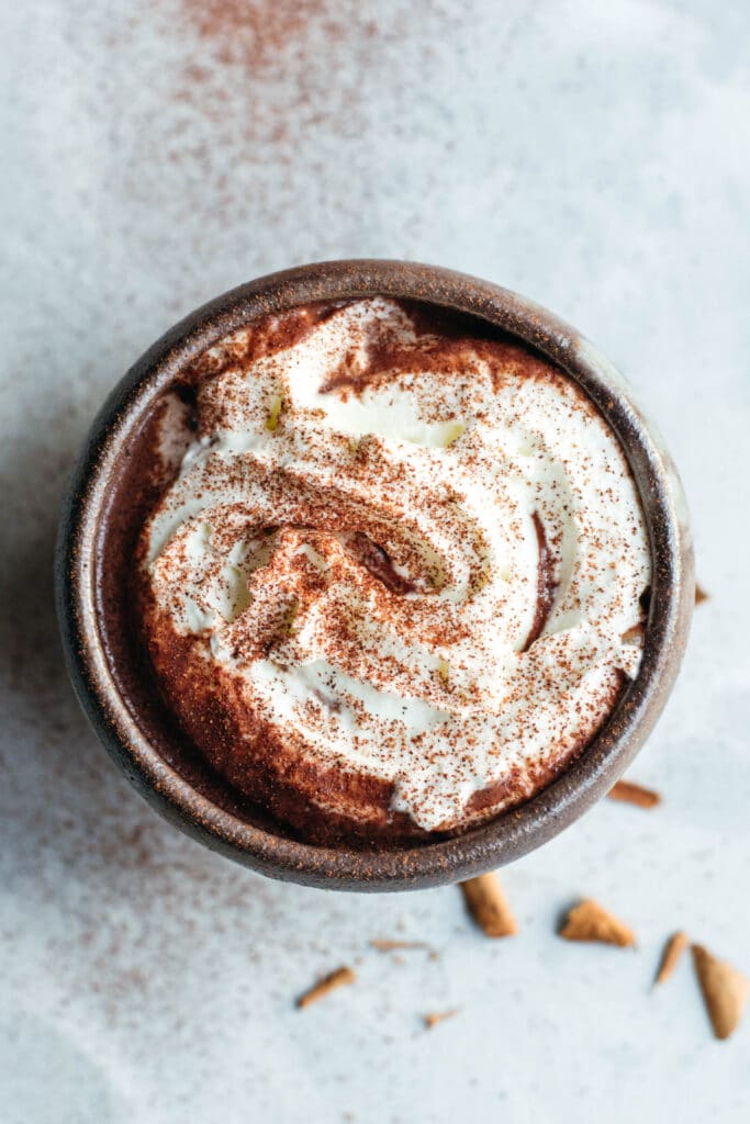 Hot chocolate with whipped cream and cinnamon