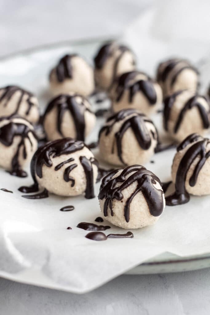 Coconut truffles with melted chocolate