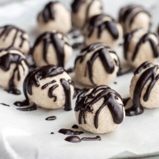 Coconut truffles with melted chocolate