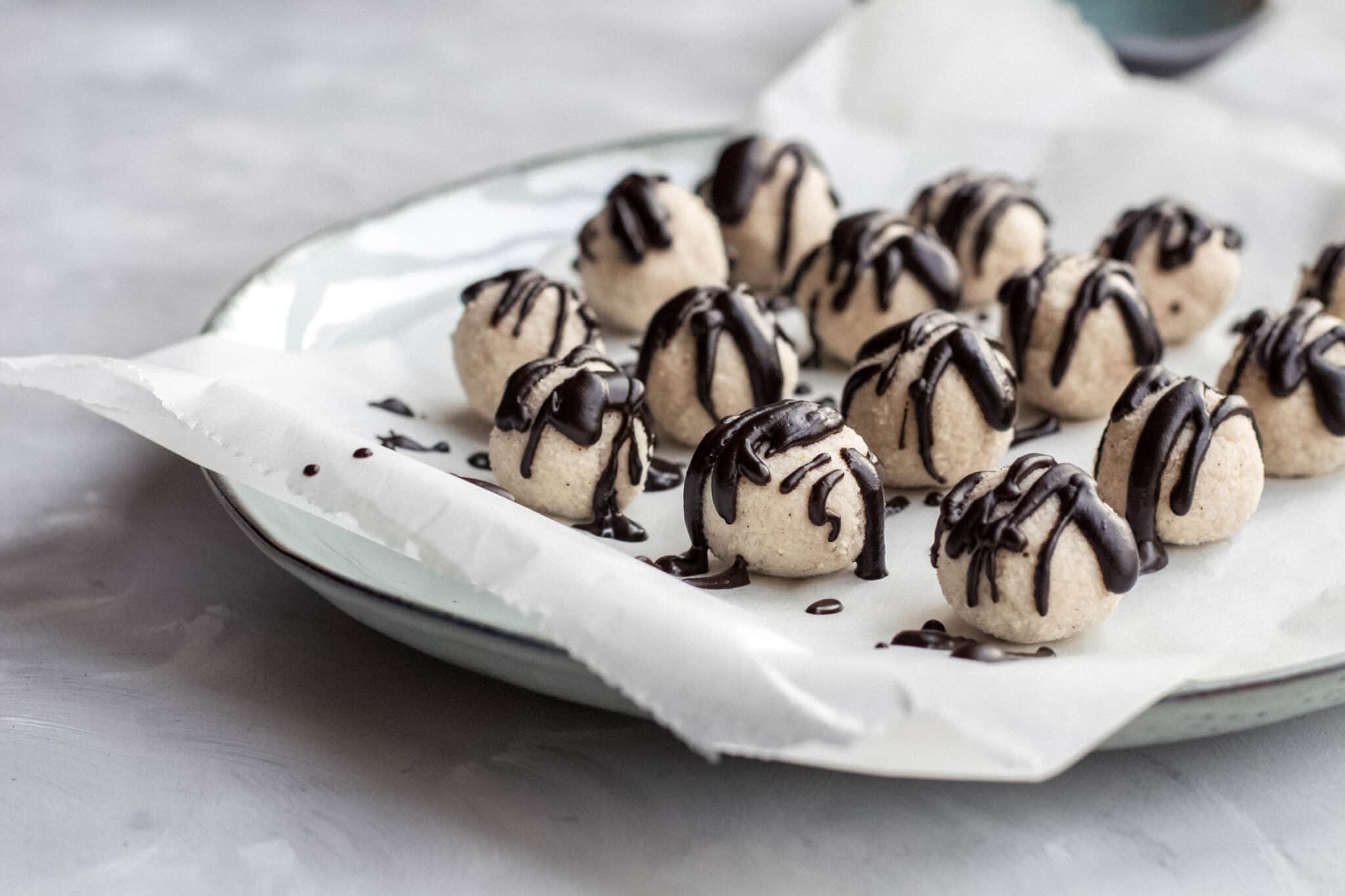 Keto coconut truffles with melted chocolate