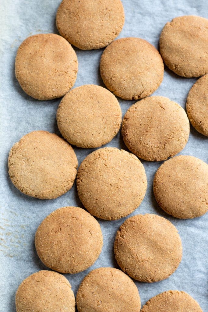 Cooked peanut butter cookies on a baking tray
