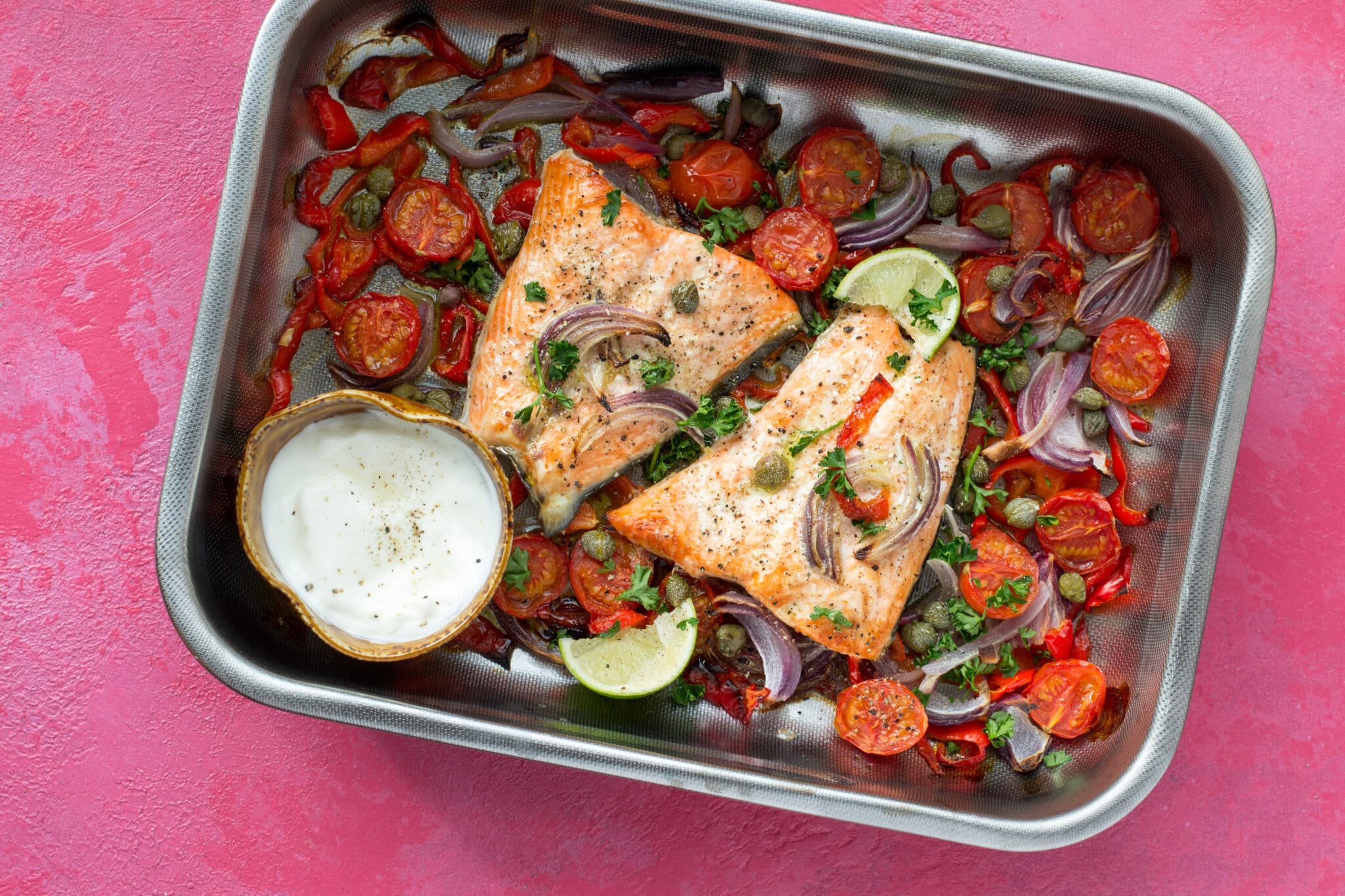 Salmon and vegetables cooked in a baking tray
