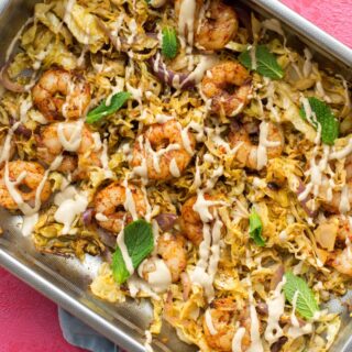 Cooked shrimp and veggies in a baking tray