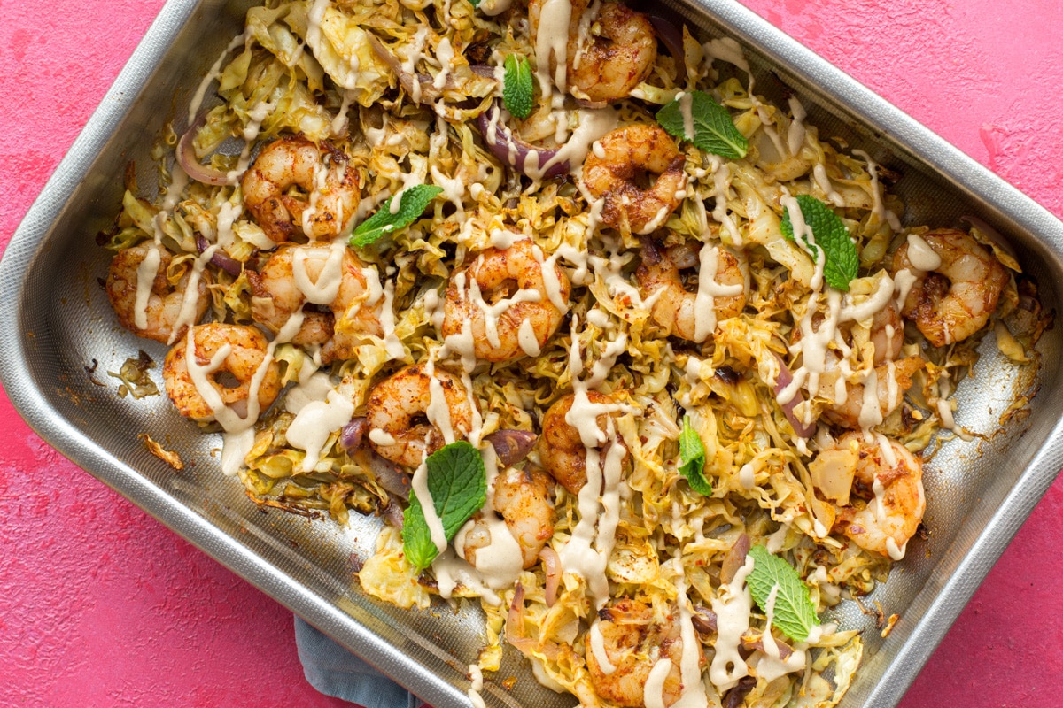 Cooked shrimp and veggies in a baking tray