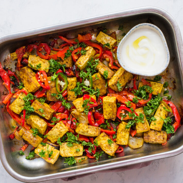 Cooked tofu and veggies dinner with a bowl of yogurt