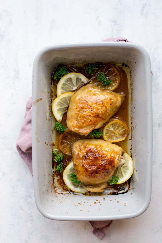 Cooked lemon chicken in a baking pan