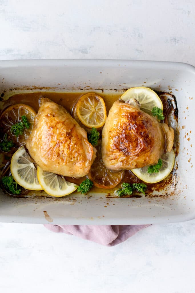 Cooked lemon chicken in a baking pan