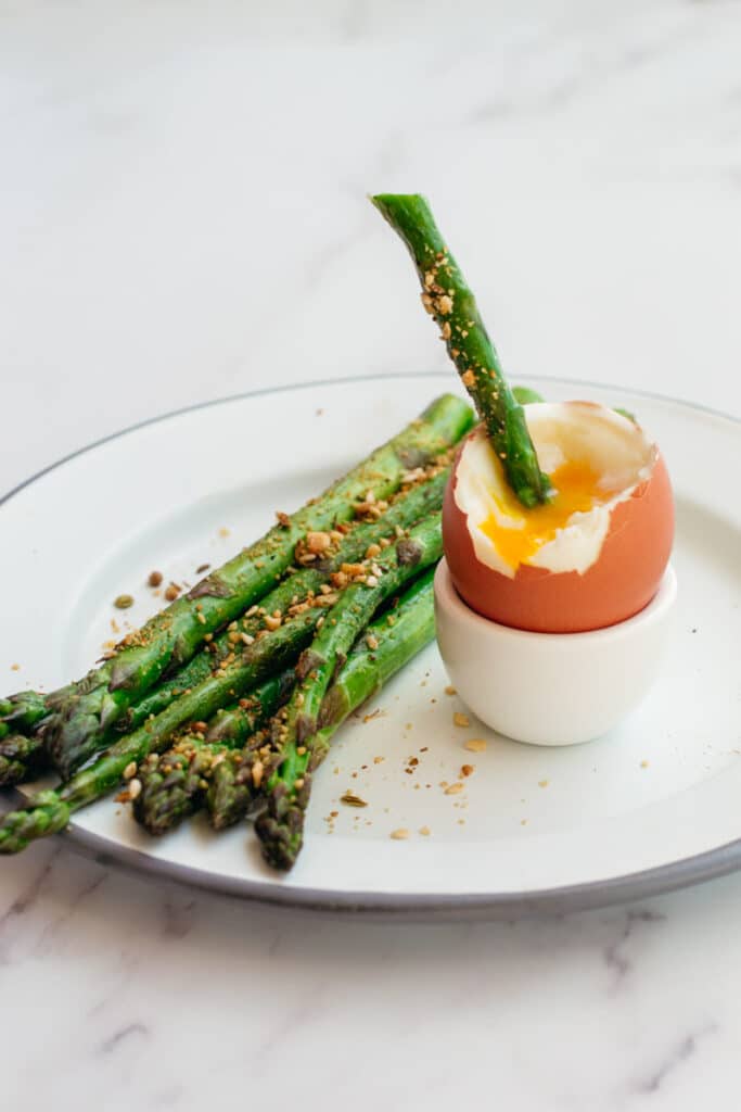 Asparagus dipped in a soft boiled egg