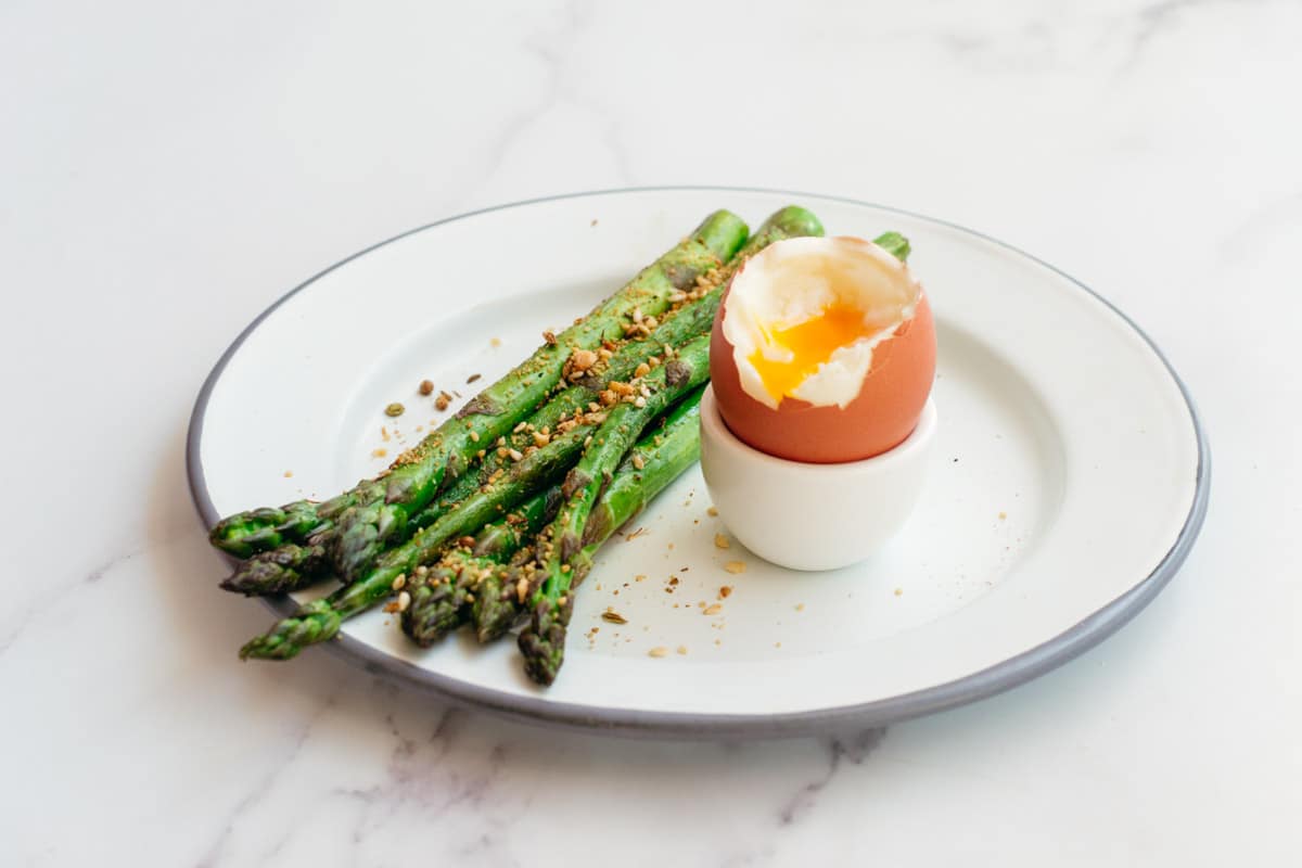 Keto breakfast with asparagus and soft boiled eggs