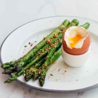 Keto breakfast with asparagus and soft boiled eggs