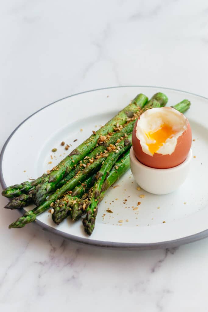 Keto breakfast with asparagus and soft boiled eggs