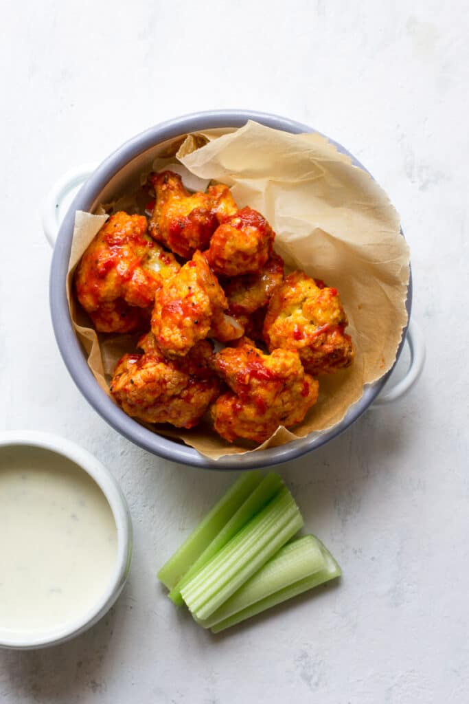 Keto cauliflower wings with blue cheese dip and celery